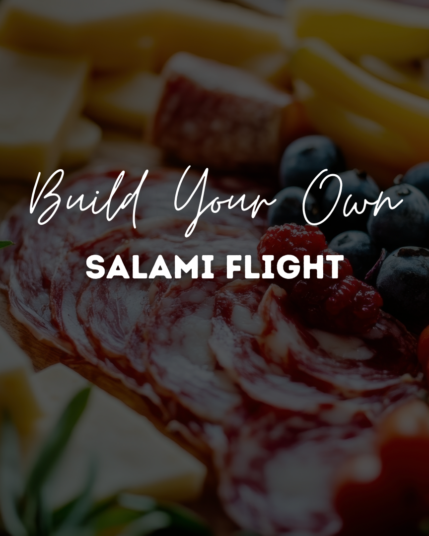Assorted meats, cheeses, and fruits with text 'Build Your Own Salami Flight' on a dark background.